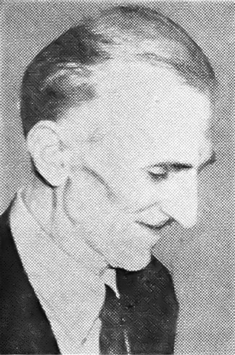 Nikola Tesla in his Later Years, Looks Down as He Smiles During Press Event